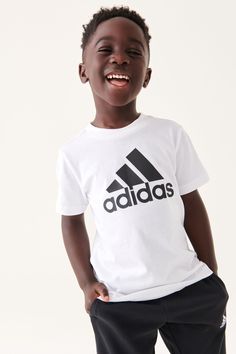 A big logo for kids who are big on fun. This kids' adidas t-shirt is made from cotton jersey that feels soft and easy as they move. The bold style teams well with sporty kicks. Our cotton products support more sustainable cotton farming. 100% Cotton. Logo For Kids, Sport Essentials, Essentials Logo, Kids Sportswear, Free Movement, Adidas T Shirt, Cotton Farming, Sun With Sunglasses