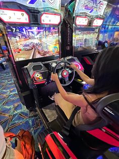 a woman playing a video game on the nintendo wii at an indoor gaming center in china