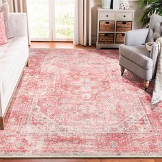 a living room with a couch, chair and rug