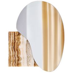 a mirror that is on top of a wooden shelf with a marble slab in front of it