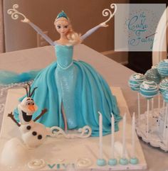 there is a frozen princess cake on the table