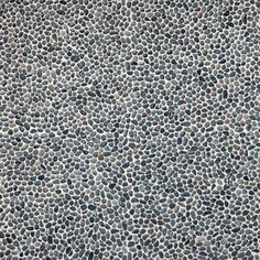 an image of a stone floor textured with small rocks or pebbles in grey and white colors