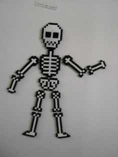 a skeleton made out of black and white beads