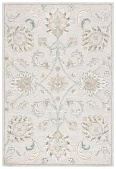 a white rug with an ornate design on it