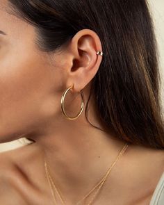 "A timeless addition to your jewelry collection, these simple tube hoops will never go out of style, no matter the season. Light as a feather and super comfortable so you can wear them all day. * D E T A I L S * ∙ Sold as a PAIR ∙ Material: .925 Sterling Silver or 18K Gold Plated over .925 Sterling Silver ∙ Dimensions: Inner diameter: 30mm - Outer diameter: 35mm // Thickness: 3mm ∙ Hypoallergenic & nickel-free * P A C K A G I N G * ∙ All jewelry is sent out beautifully packaged in our signat Classic Hoop Earrings With Simple Design, Classic Simple Hoop Earrings, Minimalist Hoop Huggie Earrings, Simple Hoop Jewelry For Everyday, Everyday Hoop Cartilage Earrings, Classic Hoop Jewelry With Simple Design, Everyday Simple Hoop Jewelry, Minimalist Hypoallergenic Hoop Jewelry, Minimalist Hoop Jewelry With Simple Design