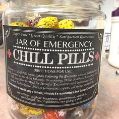 a jar filled with jelly beans sitting on top of a counter