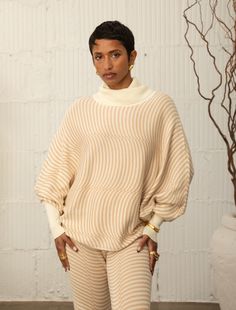 OVERSIZED TURTLENECK TOP WITH 3/4 LENGTH DOLMAN SLEEVES AND STRAIGHT SWEEP IN TWO- TONE WAVE PATTERN 50%COMBED COTTON, 50%MODAL Ka'ui is 5'8" wearing a size S/M STYLE# G1124 Available sizes: S/M, M/L Oversized Turtleneck, Turtleneck Top, Outerwear Vest, Top Sweater, Plus Size Activewear, Cardigan Vest, Team Apparel, Sweater Sale, Turtle Neck Top