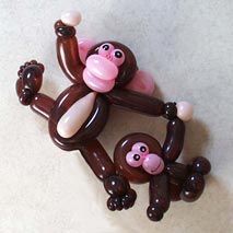 a balloon shaped like a monkey hanging from the ceiling