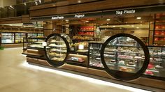 the inside of a deli filled with lots of different types of foods and pastries