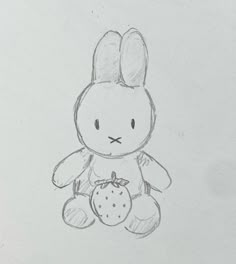 a drawing of a bunny holding a strawberry