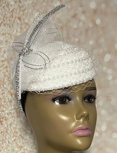 Simple, yet elegant. White lace Fascinator half hat trimmed with pearls, rhinestones, and veil netting. The hat is affixed to the head via a hatstring. The hat's circumference measures approximately 22.5 inches. PLEASE NOTE All items for Free Shipping will be shipped via USPS First Class Mail. Gifts for mom, sister, wife, or yourself. Elegant Fitted Tulle Veil, Elegant White Evening Veil, Fitted Tulle Hats For Weddings, Elegant Evening Veil With Headband, Elegant Tulle Mini Hats For Wedding, Elegant Adjustable Veil For Party, Elegant Evening Bridal Accessories With Tulle, Elegant Evening Tulle Bridal Accessories, Elegant Tulle Bridal Accessories For Evening