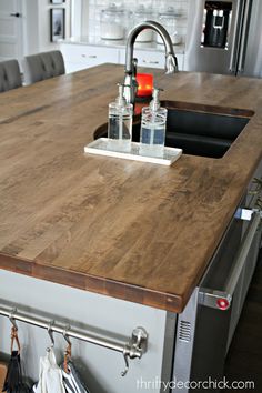 a kitchen island with two glasses on it