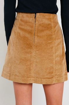 Corduroy is back in style! This mini skirt is perfect for this occasion, featuring a panel design and having a back zipper. Pair this skirt with a long sleeved top and some knee high boots for the perfect fall look. 98% cotton, 2% spandex Hand Wash Cold. imported S M L WAIST 28" 29" 30" HIP 36" 37" 38" LENGTH 16" 16.5" 17" Winter Mini Cotton Skirt, Winter Cotton Mini Skirt, Corduroy Lined Skirt Bottoms For Fall, Trendy Fall Skirt With Side Zipper, Trendy Fall Mini Skirt With Zipper Closure, Cotton Mini Skirt For Fall, Trendy Mini Skirt With Zipper Closure For Fall, Fall Mini Skirt With Zipper Closure, Fall Cotton Mini Skirt