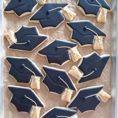 decorated cookies in the shape of graduation caps and tassels