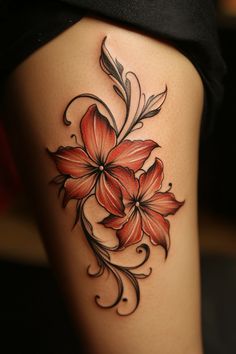 Two stylized red flowers with black swirling vines tattooed on skin. Colored Floral Tattoo Design, Fire Lily Tattoo, Elegant Flower Tattoo, Flower Tattoos Color, Single Flower Tattoo, Lily Tattoos