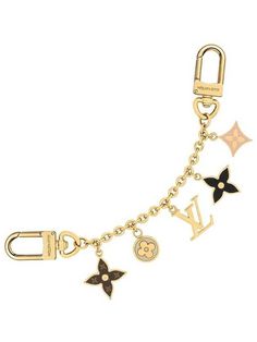 louis vuitton charm bracelet with charms on the bottom and an lv logo