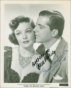 an autographed photograph of a man and woman