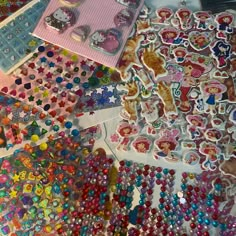 various stickers and magnets are on the table with each one's own