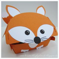 an origami box with a fox face on it