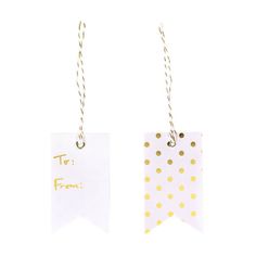 two tags with gold polka dots on them hanging from twine strings, one has a tag that says tar fron