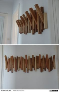 there are several pieces of wood hanging on the wall