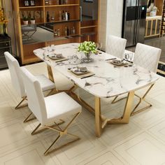 a marble dining table with gold legs and white chairs in a room that looks like a modern kitchen