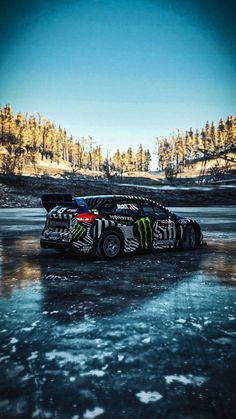 a car with monster stickers parked on ice