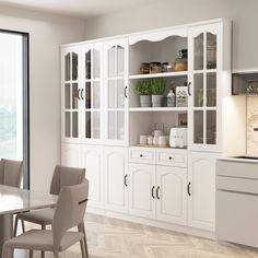 a dining room with white cabinets and chairs