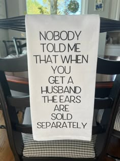 a tea towel with the words nobody told me that when you get a husband they are sold separately