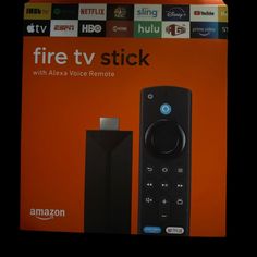 an amazon fire tv stick in front of the box