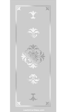 the back side of a door with an ornate design on it, in silver and white