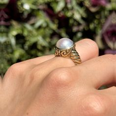 New, but old pieces, never worn, recently acquired from a premier jeweler located in Minneapolis, MN for many years- A rare opportunity! 14KT yellow gold genuine, bezel-set, Mabe pearl ring with Etruscan/ filigree design. Size 6.25 Sizable by us for a fee or your local jeweler Weight: 7.90 grams Band width: 4mm 11mm pearl Stamped 14k Elegant White Gold Rings With Cabochon, Elegant White Gold Cabochon Rings, Elegant Yellow Gold Jewelry With Cabochon, Elegant Yellow Gold Cabochon Jewelry, Elegant White Domed Rings, Elegant Baroque Gemstone Jewelry, Timeless White Gold Jewelry With Cabochon, Elegant Domed Jewelry With Bezel Setting, Elegant Cabochon Rings For Anniversary