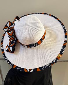 ombines timeless elegance with vibrant cultural flair. Handcrafted with care, this hat features a beautifully woven straw base adorned with bold African print fabric, offering both style and sun protection. Perfect for church services, outdoor events, or simply adding a touch of sophistication to your outfit, this hat blends tradition with modern design. Lightweight and breathable, it's as comfortable as it is striking. Elevate your look with a hat that celebrates heritage and craftsmanship. One size: should fit all. **** The straw hat color might vary from white to Beige. Ankara Bags, Spice Gift, African Print Fabric, African Fabric, Long Sleeves Jacket, Outdoor Events, Sun Hat, Straw Hat, Print Fabric