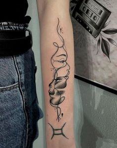 a woman's arm with a tattoo on it