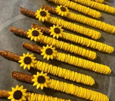 sunflowers and pretzels are arranged in rows on a plate