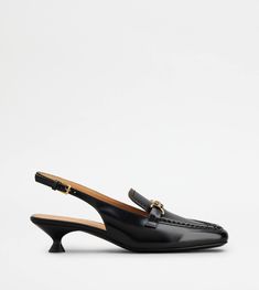 Characterized by a metal Tod's monogram clamp, these loafers in slingback version are crafted in calfskin leather. Featuring a functional heel strap, they come with a leather low heel and outsole. A versatile creation, refined combination of classic elements and contemporary mood. Gift Boutique, Trainers Women, Strap Heels, Low Heels, Leather Heels, Calf Skin, Leather Straps, Leather Upper, Dust Bag