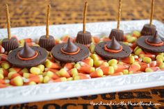 chocolate candy candies are arranged on top of candy corn