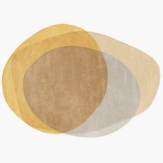 three oval rugs in various colors on a white background, each with different shapes and sizes