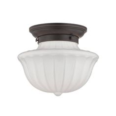 a ceiling light with a white glass shade