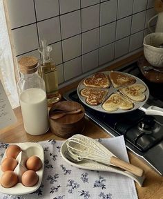 some food is sitting on a table next to the stove