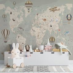 a child's room with a world map wallpaper