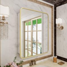 a bathroom sink with a large mirror above it and flowers in front of the window