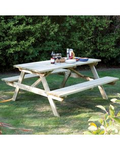 a picnic table with two bottles of wine on it