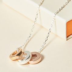 Treasure the bonds of an everlasting love with our Personalized Unity Trio Necklace. Each disc, as unique as its chosen metal, shines with individuality. Create a necklace to cherish by choosing the names and dates closest to their heart to discreetly engrave onto each charm.&nbsp;18K Champagne Gold Plated, 925 Sterling Silver and 18K Rose Gold platedUnity charm size: Diameter 0.5 and Thickness 0.1Hand engraved in our Paris workshopSent with love in a complimentary gift boxAny slight variati Anniversary Charm Necklace With Round Pendant, Anniversary Necklaces With Round Pendant Charms, Anniversary Necklace With Round Pendant Charms, Round Pendant Necklace With Charms For Anniversary, Round Pendant Necklace With Charms For Anniversary Gift, Rose Gold Charm Necklaces For Anniversary, Rose Gold Charm Necklaces For Anniversary Gift, Rose Gold Charms Necklace For Anniversary Gift, Rose Gold Necklaces With Charms For Anniversary