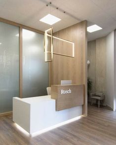 a reception area with wooden floors and white walls