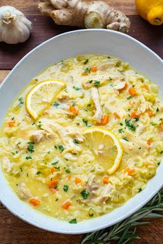 a white bowl filled with chicken and lemon soup