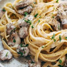 pasta with mushrooms and parsley on a plate