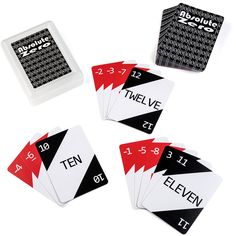 four playing cards with numbers on them sitting next to each other in front of a white background