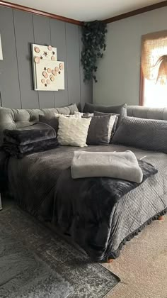 a large bed sitting in the middle of a living room