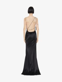 Long evening dress with satin. Open back with embroidered crystals asymmetric straps detail. Draped. Invisible zipped closure on the side. Slit on the front. Long flowing skirt. Model measures 5.8 Feet and wears a size 36. Long Flowing Skirts, Skirt Model, Givenchy Women, Long Evening Dress, Html Color, Cowboy Boots Women, Flowing Skirt, Draped Dress, Evening Dresses Long